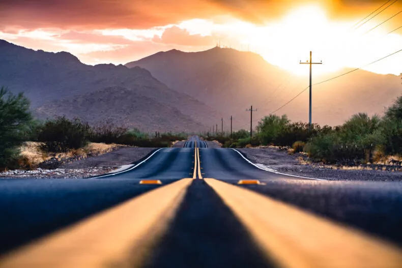 empty road in in desert. Where a Phoenix Uber and Lyft accident lawyer helps