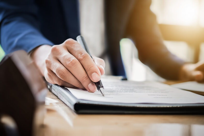 male attorney working on a case for a wrongful death caused by motor vehicle accidents