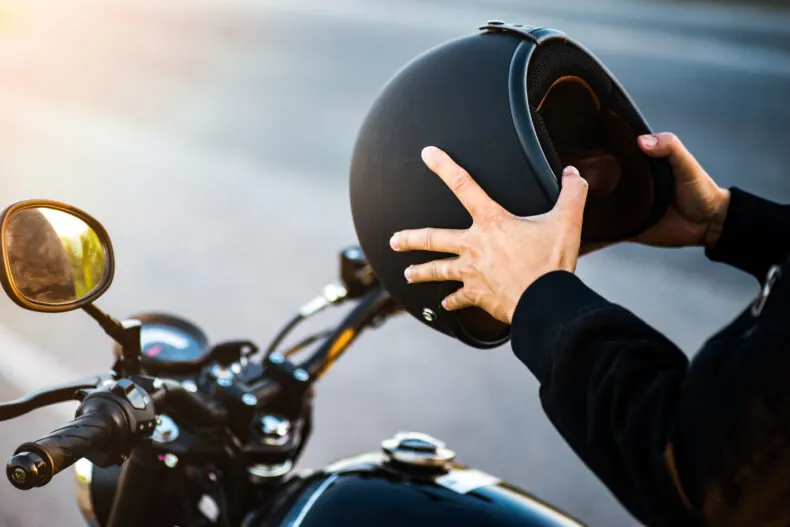 Wearing a helmet to protect head in motorcycle accident