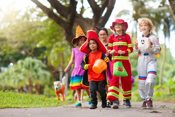 trick or treaters wearing halloween costumes