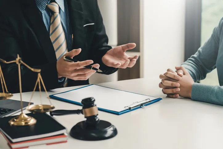 personal injury lawyer speaking to client